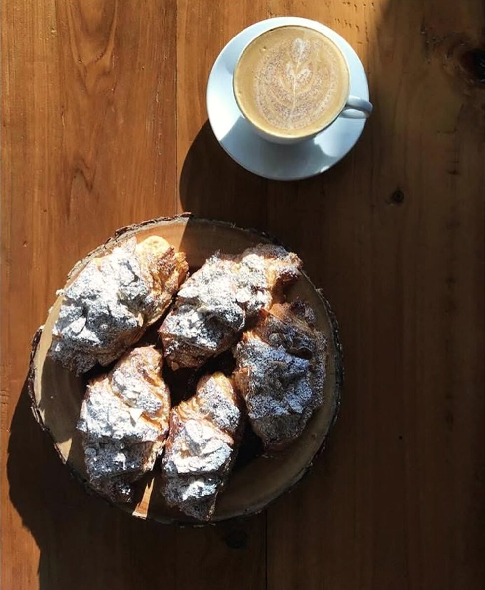 Twice-baked almond croissants dusted with powdered sugar