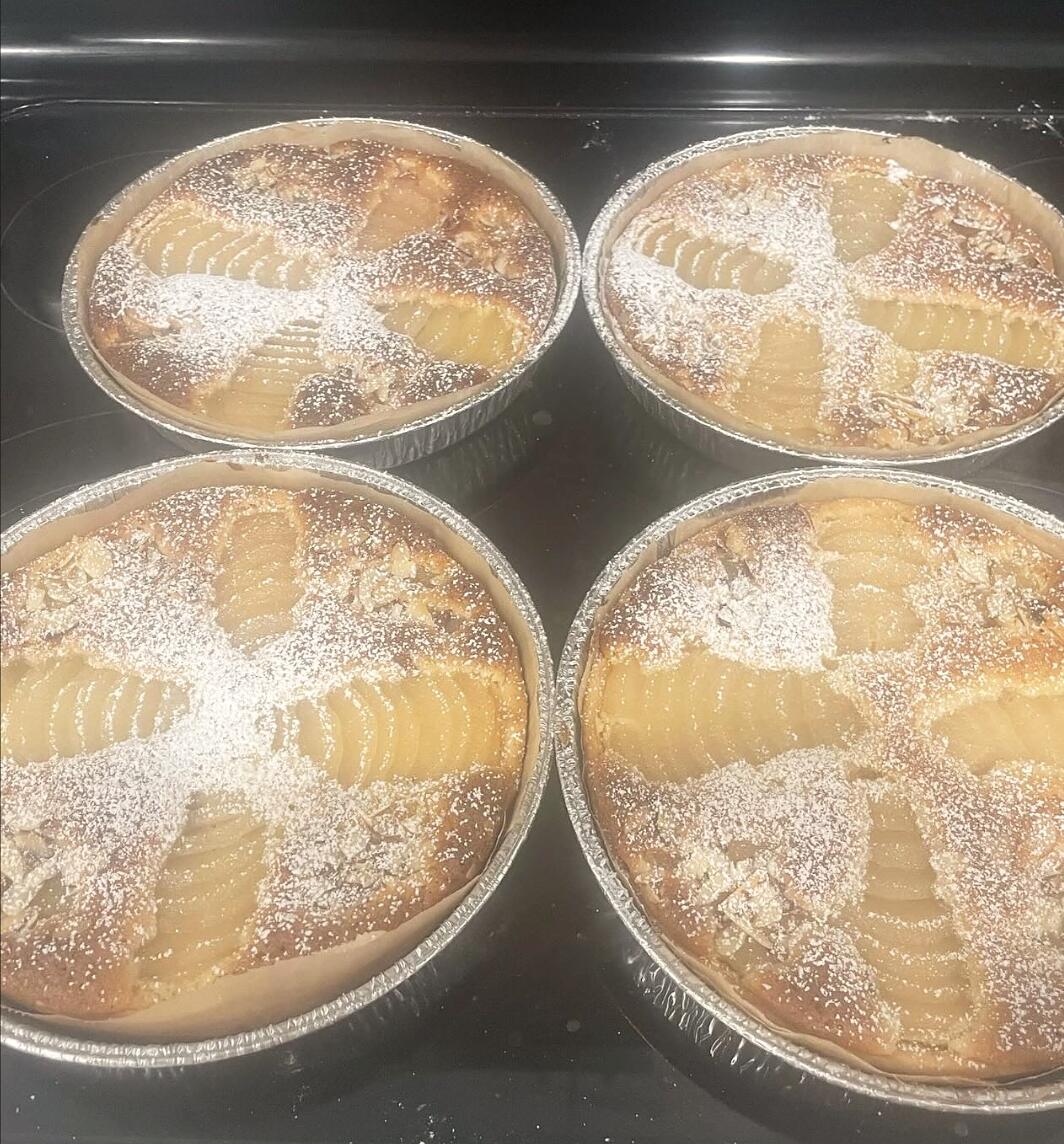Tarte bourdaloue pear and almond tarts dusted with powdered sugar